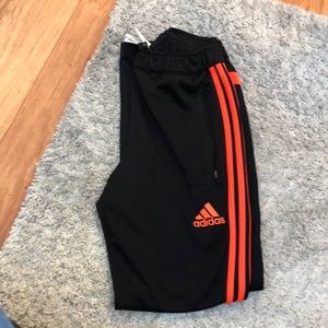 Adidas track pants. Orange. Good condition.